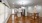 Living room upstairs with wood floors and kitchen 